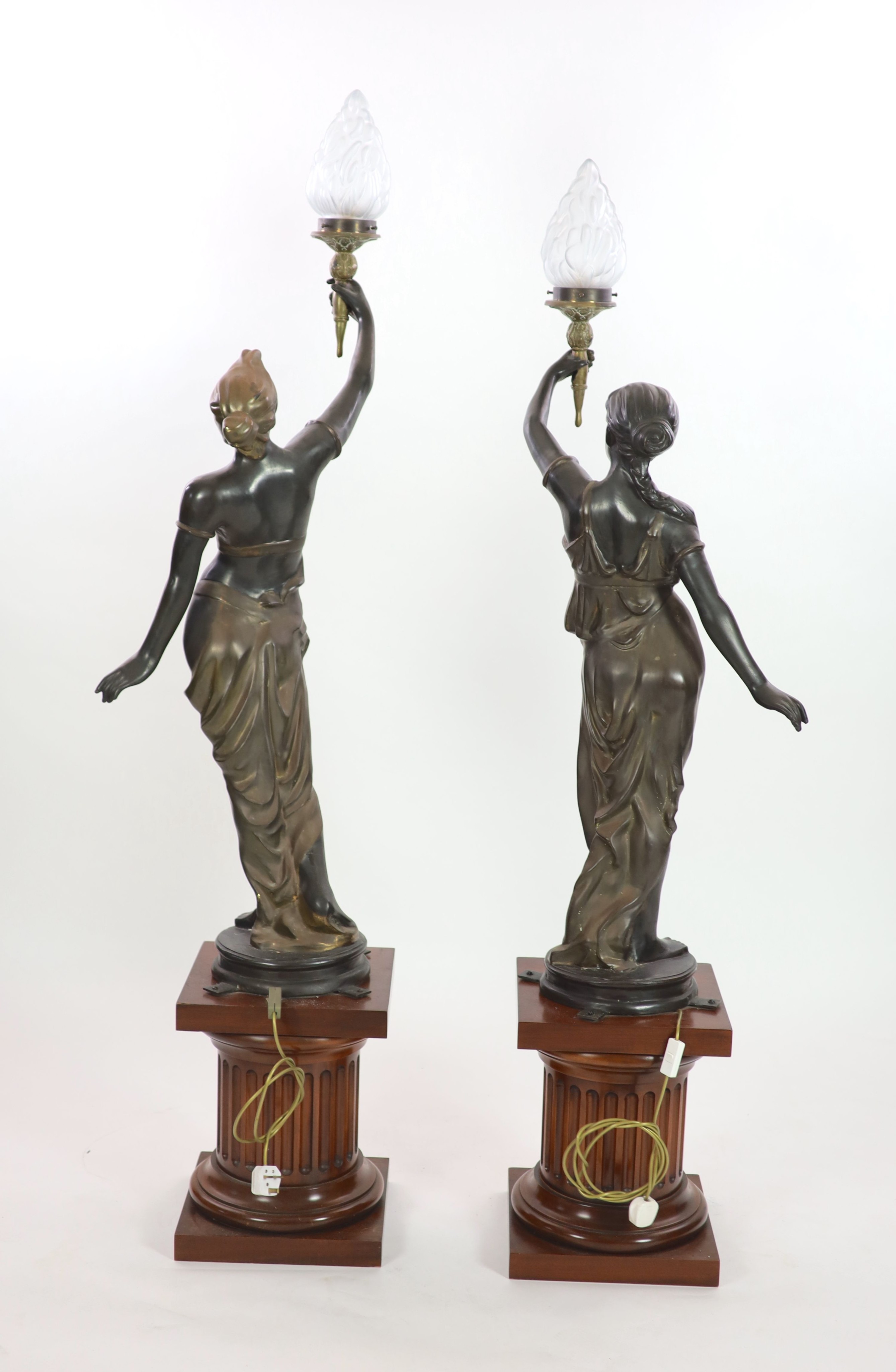 A pair of 19th century style bronze figural torcheres, overall H 192cm